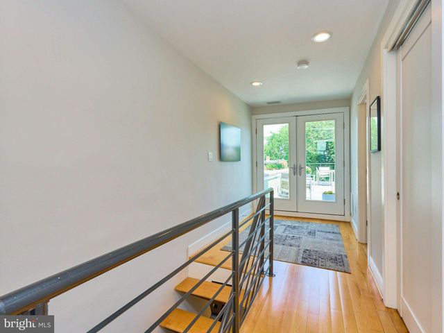 a view of an entryway with wooden floor