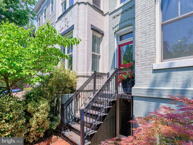 front view of a house with a small yard