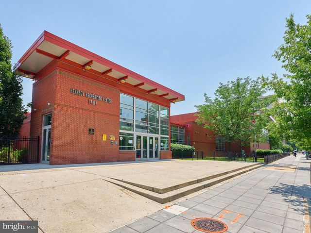 a backyard of a house with a basket ball court