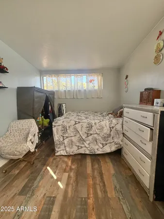 a bed room with a bed and a window