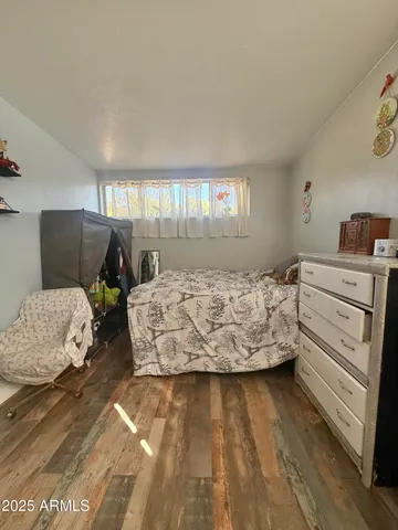 a bed room with a bed and a window