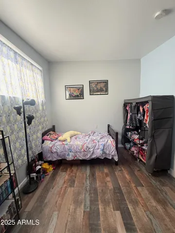 a bed room with a bed and a window