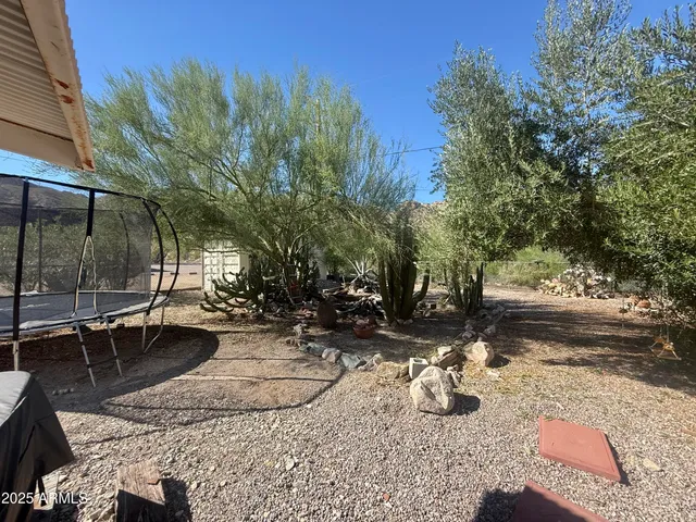 a view of a backyard with sitting area