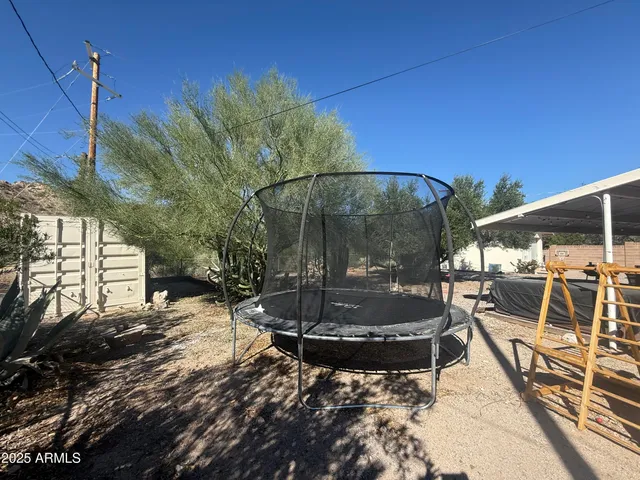 a view of a swimming pool with a patio