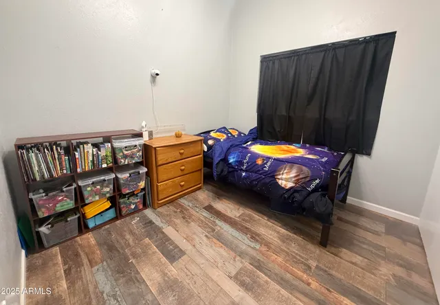 a bedroom with bunk bed and a dresser