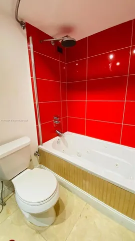 a bedroom with a bed and couch