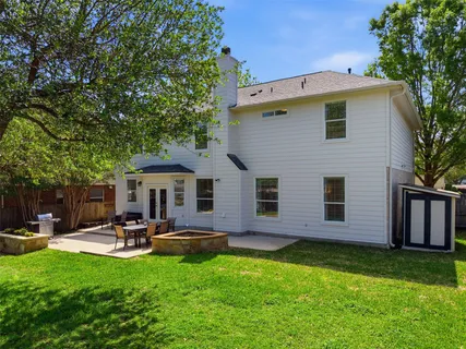 a front view of house with yard and outdoor seating