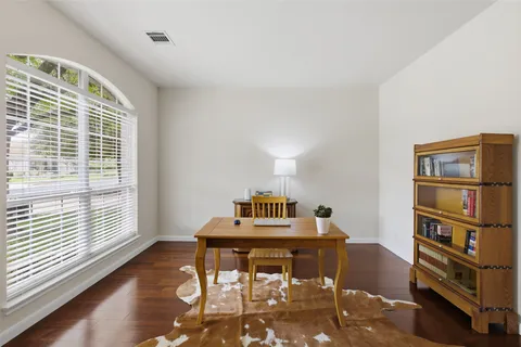 a workspace with furniture and windows