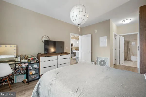 a bedroom with bed and window