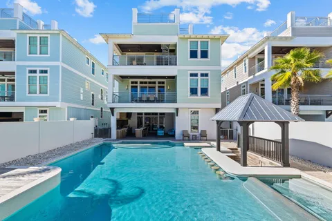 a aerial view of a house with swimming pool