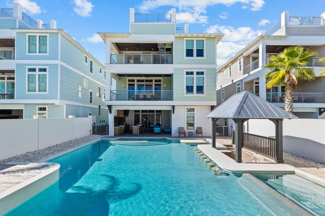 a aerial view of a house with swimming pool