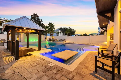 a living room with furniture a dining table and a piano table