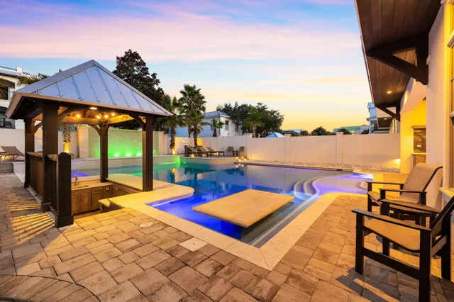 a living room with furniture a dining table and a piano table