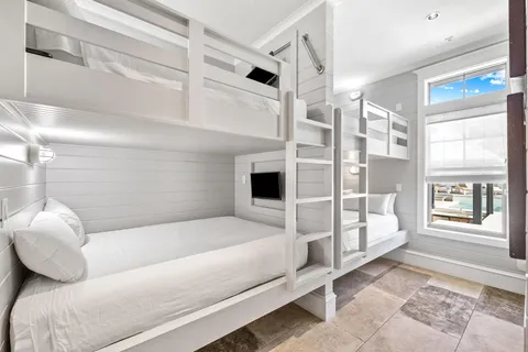a kitchen with granite countertop a stove and cabinets