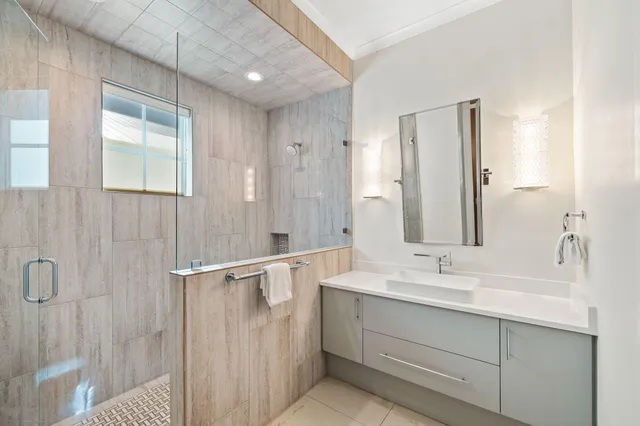 a view of a balcony with chairs and wooden floor