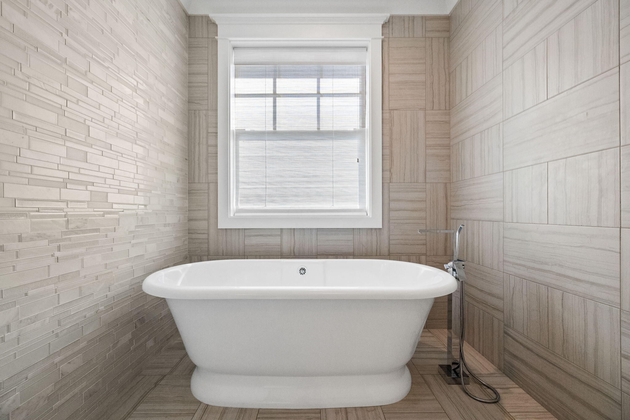 89 Shirah Street Destin, FL 32541 - Photo 51 of 69 a white bath tub sitting in a bathroom next to a window