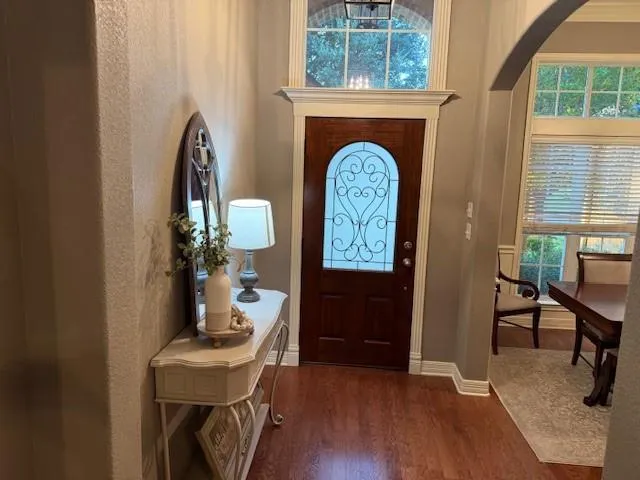 a view of hall way with furniture and workspace