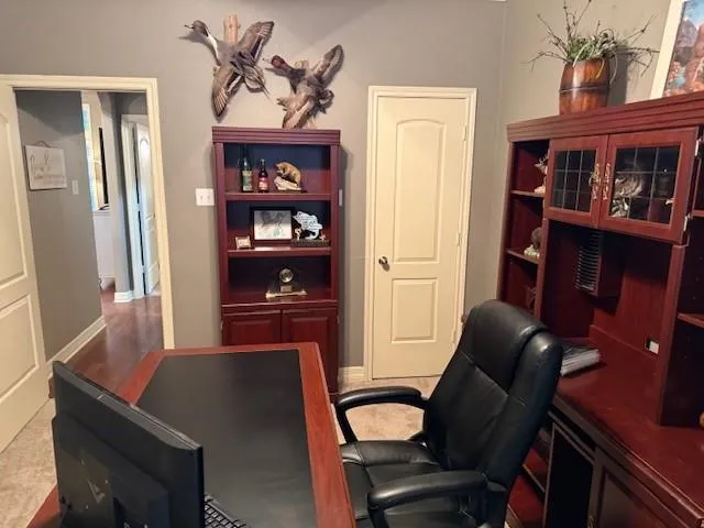 a work room with furniture and wooden floor