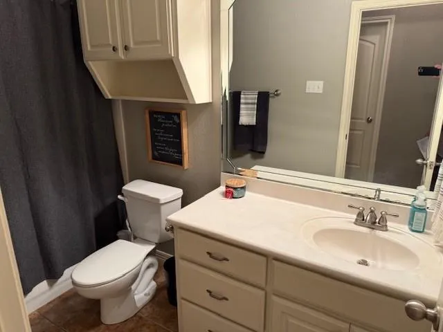 a bedroom with a bed and cabinets