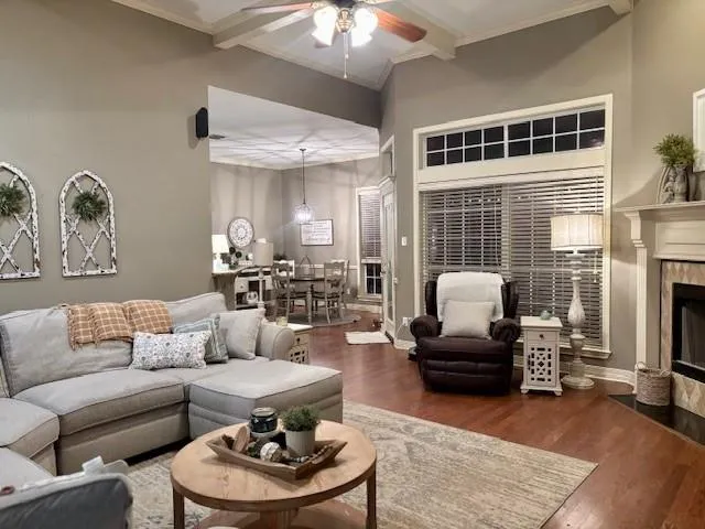 a living room with furniture and a fireplace