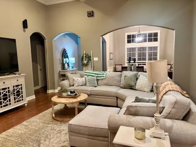 a living room with furniture fireplace and flat screen tv
