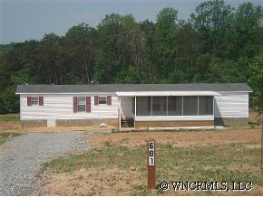 601 Parris Road Rutherfordton, NC 28139 - Photo 1 of 12 a front view of a house with a yard