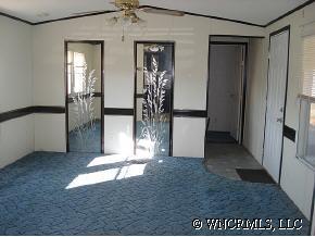 601 Parris Road Rutherfordton, NC 28139 - Photo 5 of 12 an entryway of a house with wooden floor