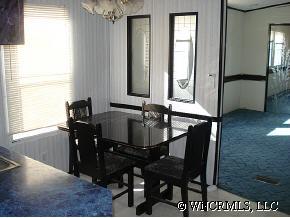 601 Parris Road Rutherfordton, NC 28139 - Photo 7 of 12 a view of a dining room with furniture and window