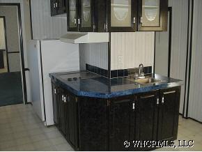 601 Parris Road Rutherfordton, NC 28139 - Photo 9 of 12 a kitchen with a sink and a refrigerator