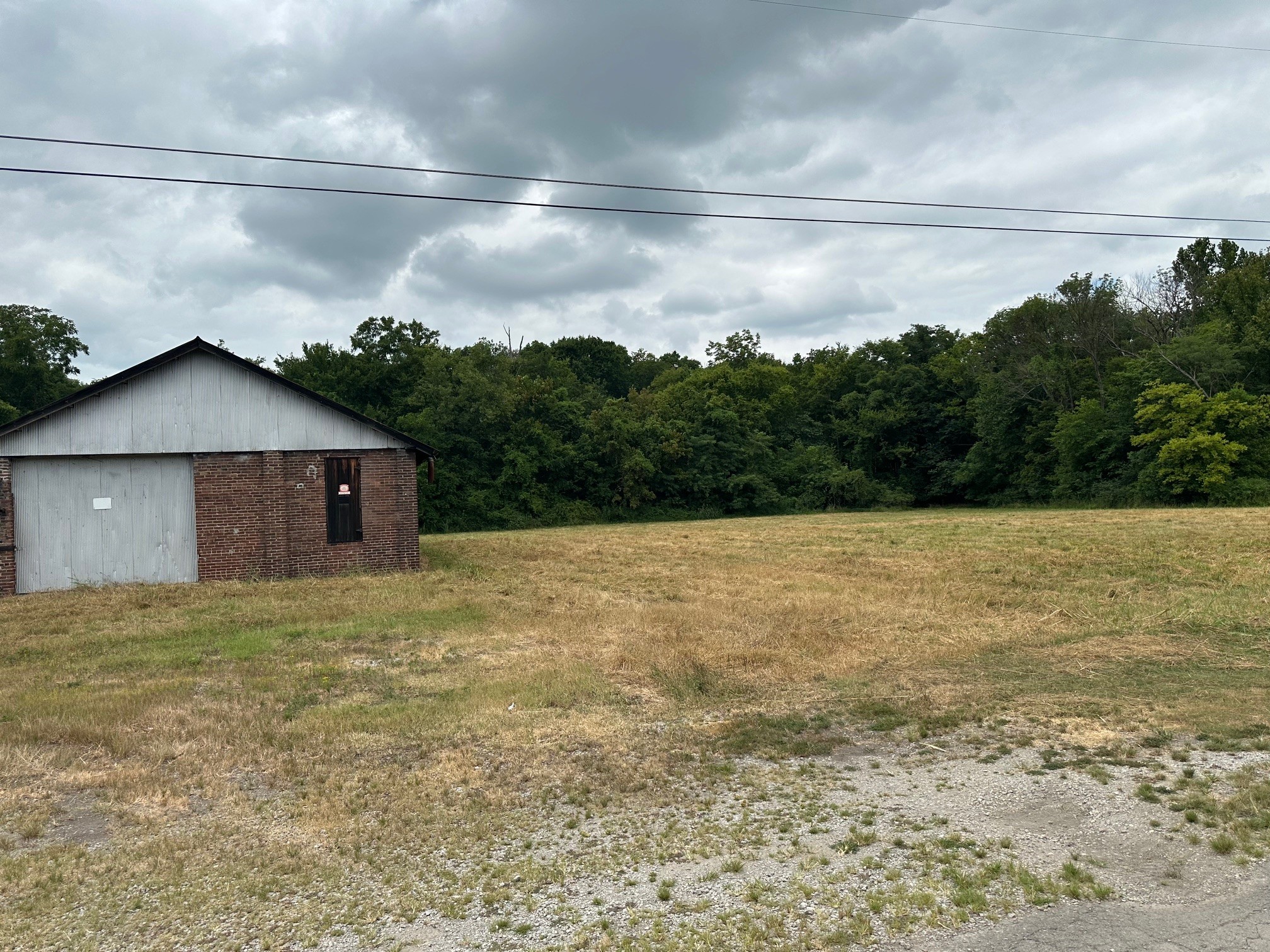 0 Railroad Street Mount Pleasant, TN 38474 - Photo 1 of 8 a view of a house with a backyard