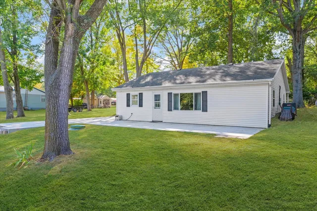 a backyard of a house with lots of green space