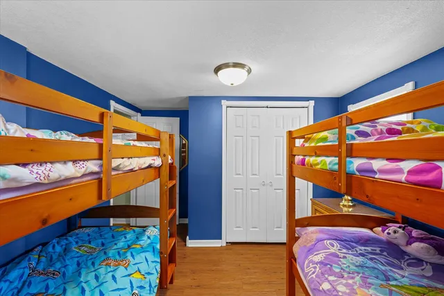 a front view of house with a garden