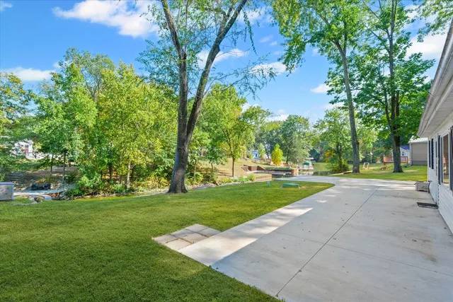 a view of a yard with a tree