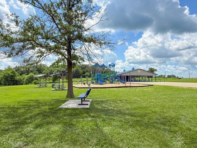 958 North 3555 East Road Neoga, IL 62447 - Photo 36 of 39 a view of a garden with a bench in the garden