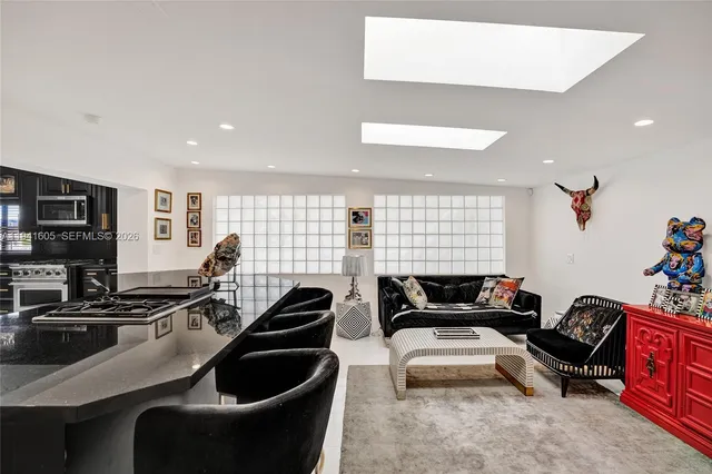 a bedroom with a large bed and a large window