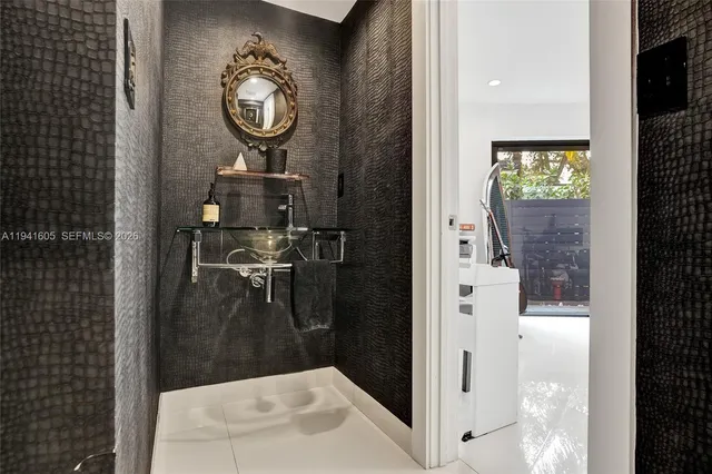 a bathroom with a double vanity sink toilet and shower