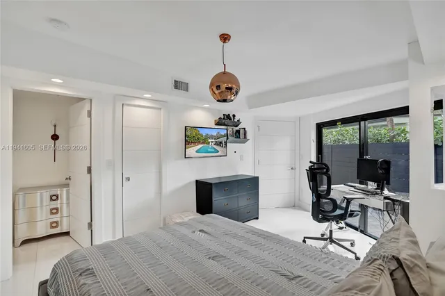 a bathroom with a double vanity sink and mirror