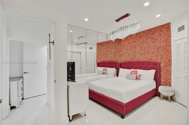 a kitchen with stainless steel appliances granite countertop a refrigerator stove and oven