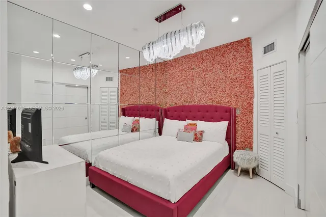 a kitchen with stainless steel appliances a refrigerator and a stove top oven