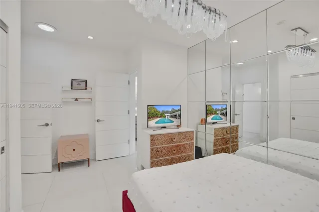 a kitchen with stainless steel appliances kitchen island granite countertop a refrigerator and a stove top oven