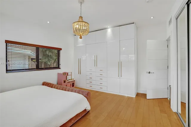 a bathroom with a sink toilet a mirror and shower