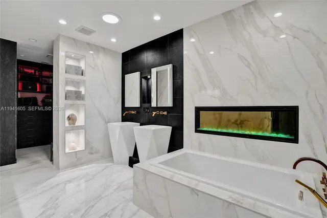 a bedroom with 2 bed and a chandelier