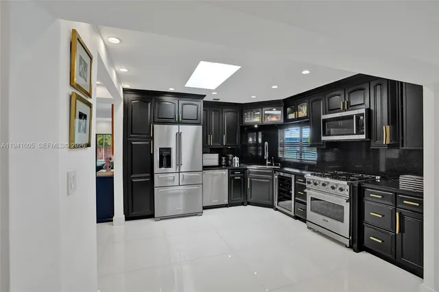a view of a house with backyard porch and sitting area