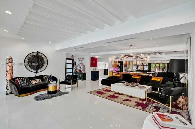 a view of a kitchen with fridge and a flat screen tv