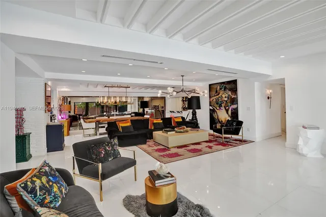 a living room with fireplace furniture and a flat screen tv