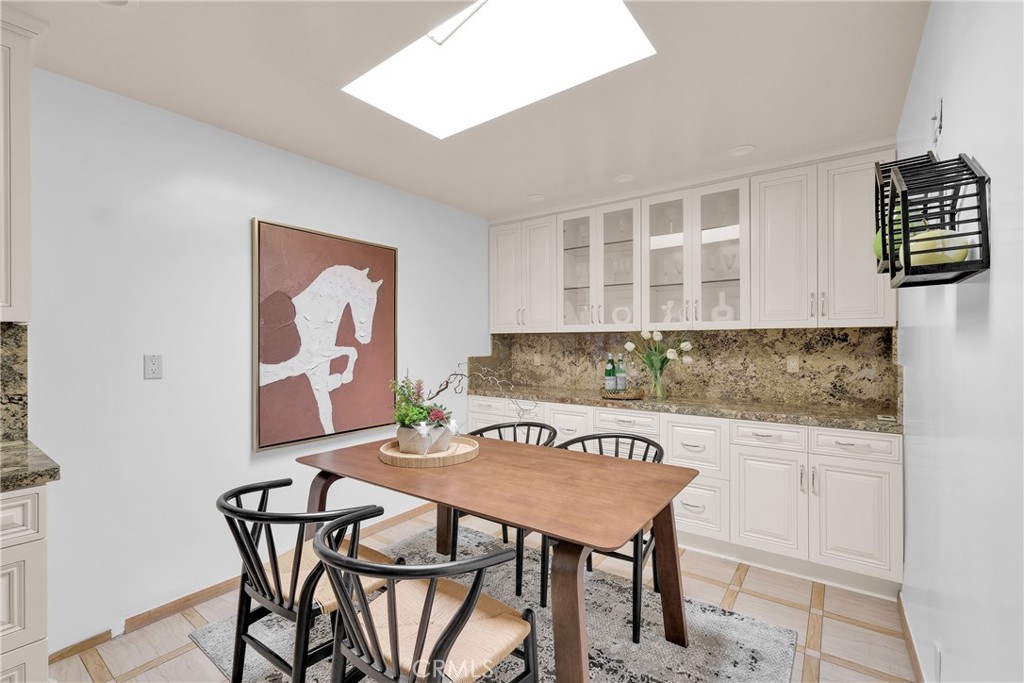 2395 Cooley Place Pasadena, CA 91104 - Photo 12 of 46 a view of a dining area with furniture and wooden floor