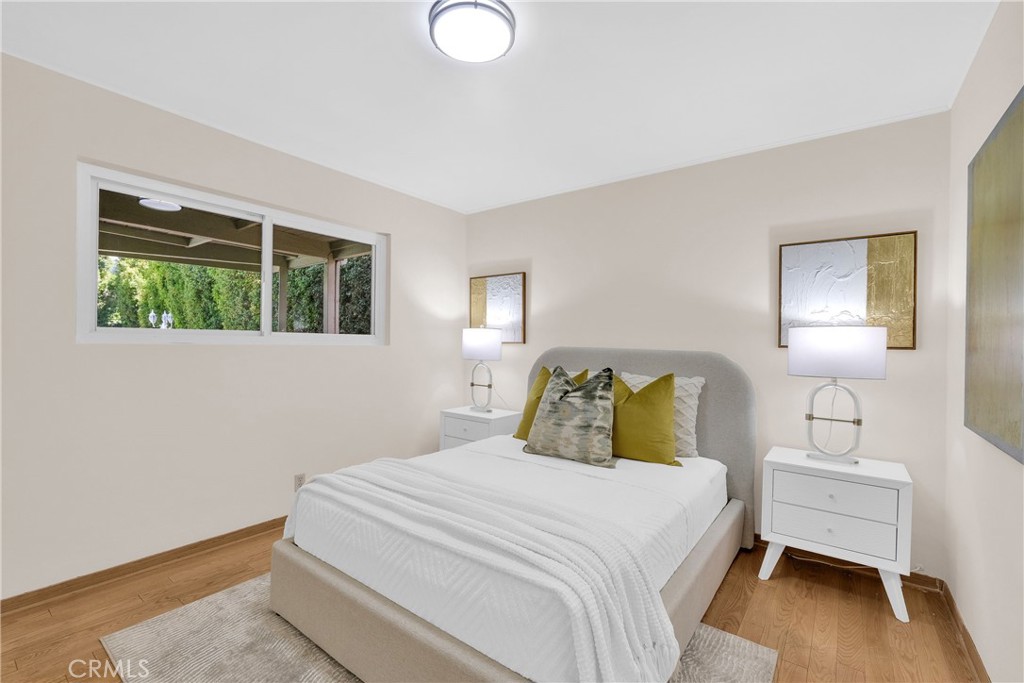 2395 Cooley Place Pasadena, CA 91104 - Photo 23 of 46 a bedroom with a bed and a lamp