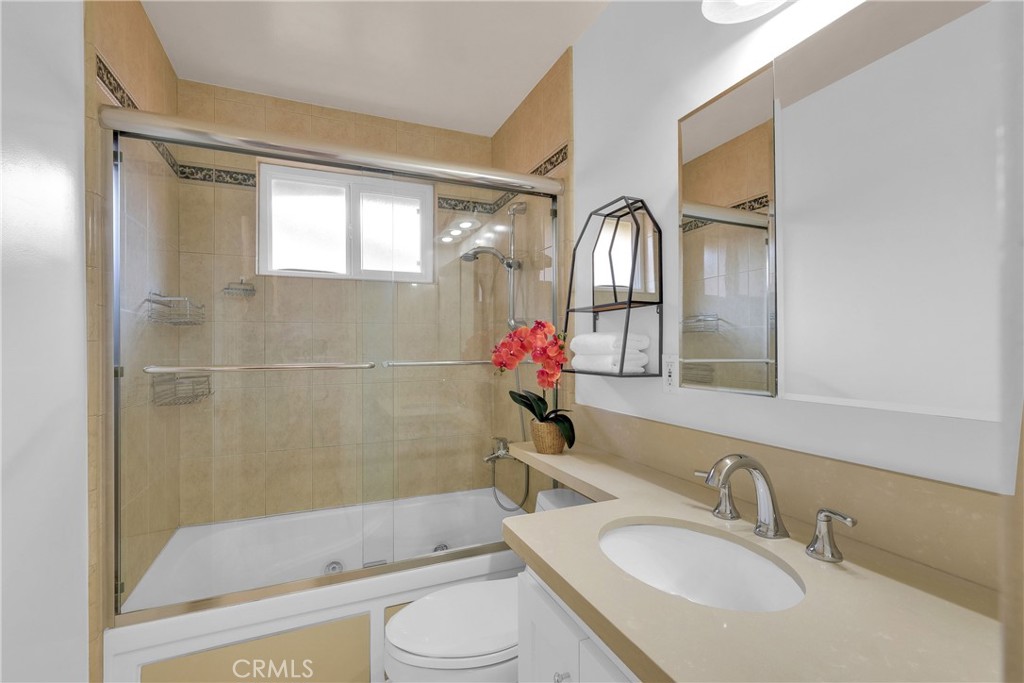 2395 Cooley Place Pasadena, CA 91104 - Photo 25 of 46 a bathroom with a sink toilet and shower