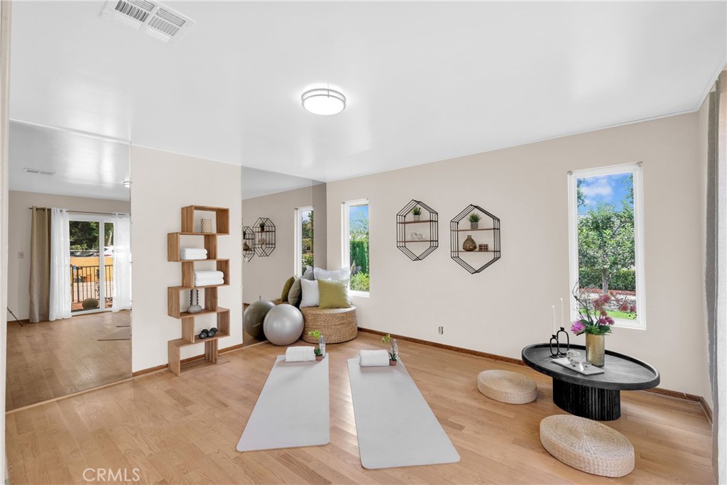 2395 Cooley Place Pasadena, CA 91104 - Photo 26 of 46 a living room with furniture and a book shelf