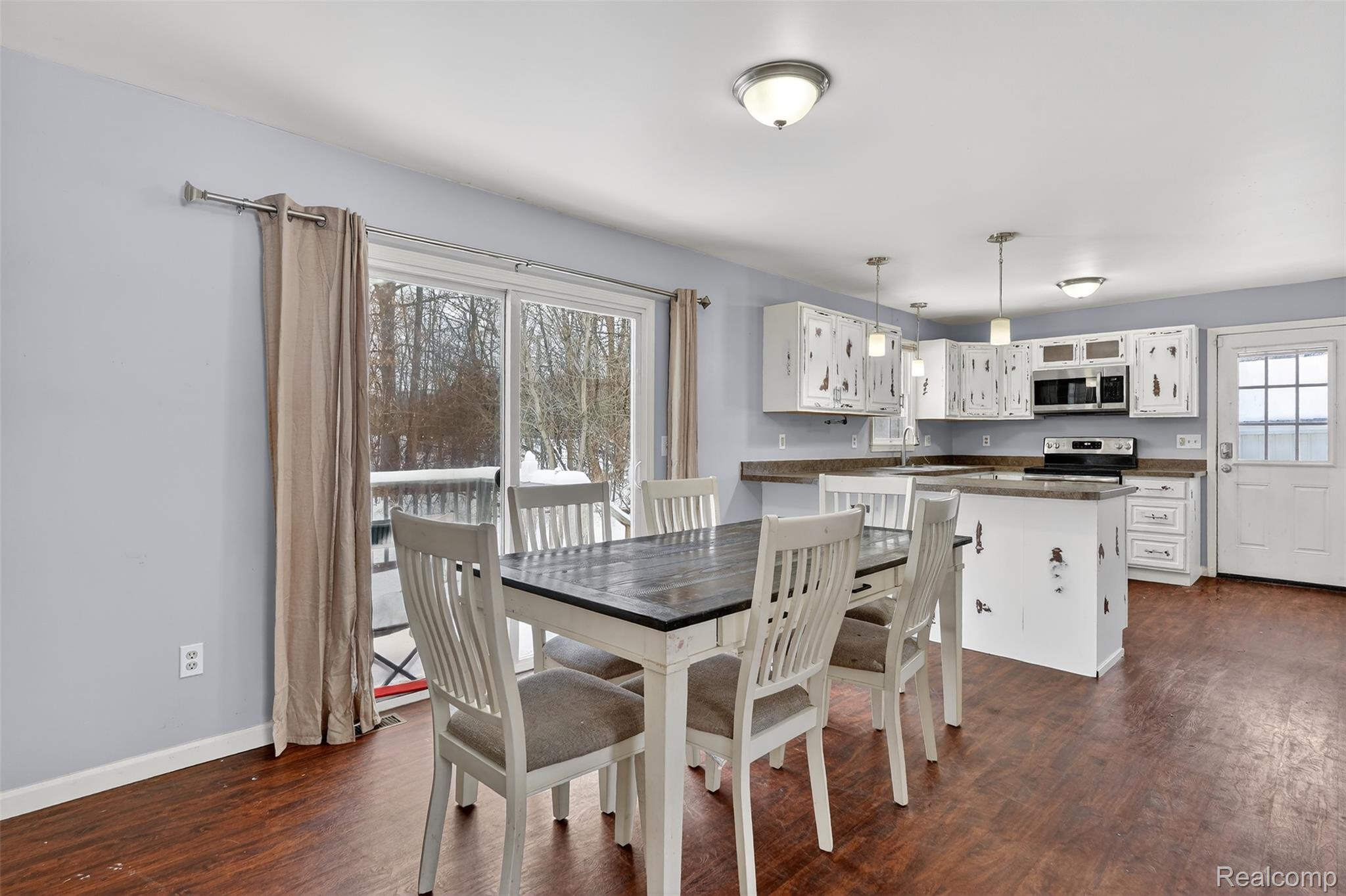 5417 Rensselear Drive Lapeer, MI 48446 - Photo 9 of 41 Dining space featuring dark wood finished floors and baseboards